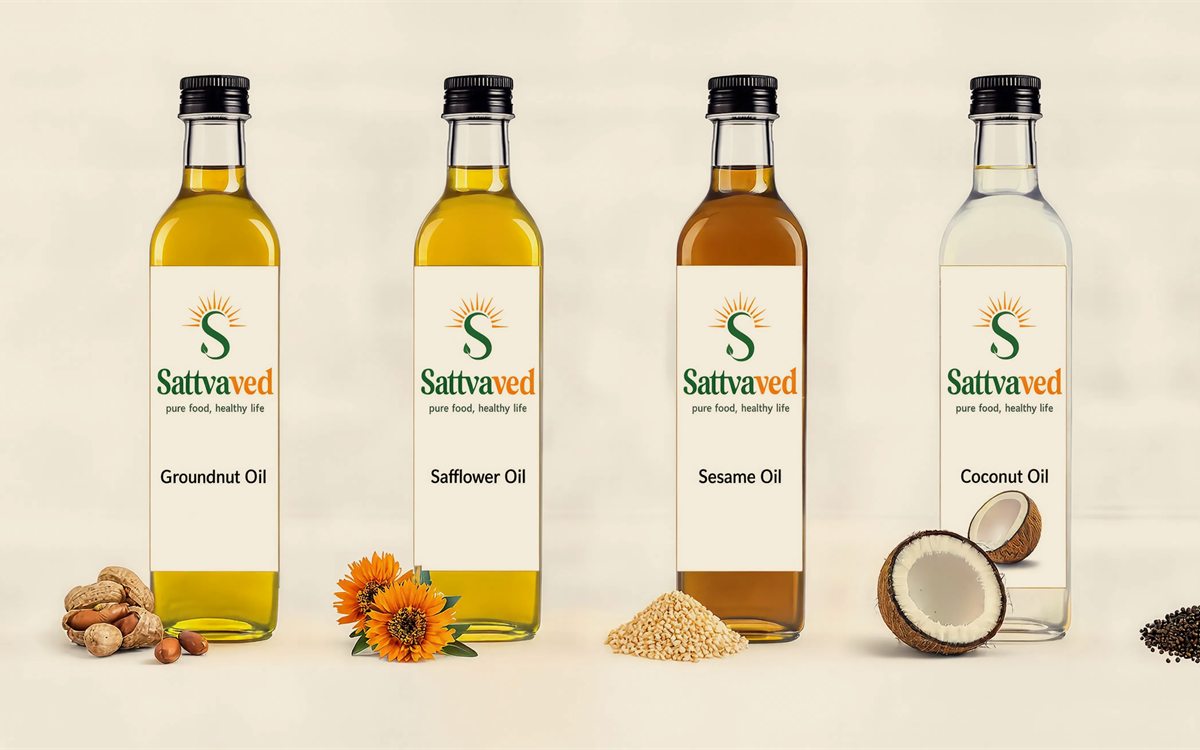 Sattvaved wood-pressed oil bottles — groundnut, safflower, sesame and coconut oil